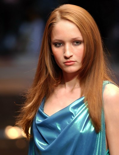 Woman with long and smooth ginger hair