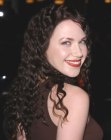 Adrienne Frantz with her hair styled into long spiral curls