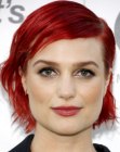 Alison Sudol wearing her red hair short and disheveled