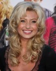 Aly Michalka with her long layered hair styled into curls and waves
