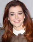 Alyson Hannigan wearing her hair long with waves and curls