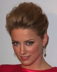 Amber Heard's updo with a banana roll and volume