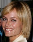 Amber Valletta wearing her hair in a short style that touches her collar