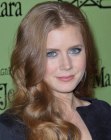 Amy Adams wearing her long hair in lush curls and waves