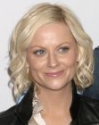 Amy Poehler sporting a neck-length bob with curls