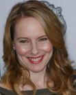 Amy Ryan's long hairstyle with loose spiral curls