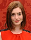 Anne Hathaway wearing her medium long hair in a one length bob with textured ends