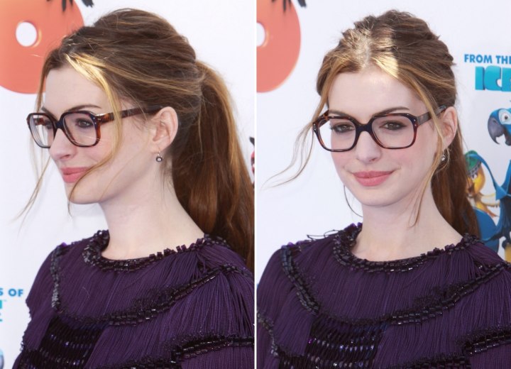 Anne Hathaway wearing large glasses