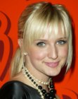 Ashlee Simpson sporting a simple ponytail with smooth and shiny styling