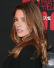Ashley Greene's timeless long layered hairstyle with a side part