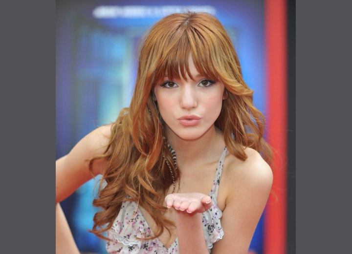 Bella Thorne's hair with spiral curls and long bangs
