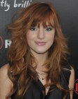 Bella Thorne's long razor cut hair with bangs and curls