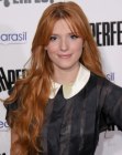 Bella Thorne sporting a retro look with long curled hair