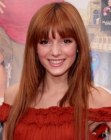 Bella Thorne's long haircut with angled sides and thick bangs