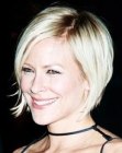 Brittany Daniel with a short stacked bob