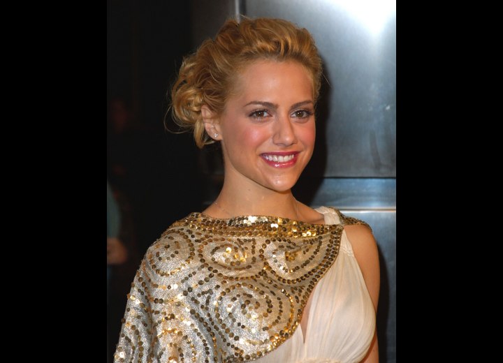 Brittany Murphy wearing her hair styled up in a bun