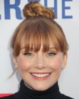 Bryce Dallas Howard's updo with bangs and a top knot
