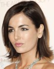 Camilla Belle wearing her hair in a medium length face-framing cut with layers