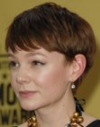 Carey Mulligan sporting a short hairstyle with bangs