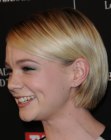 Carey Mulligan's short bob haircut with one side tucked behind her ear
