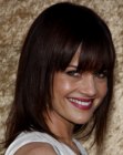 Carla Gugino's long hair with angled sides and heavy bangs
