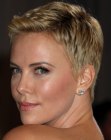 Charlize Theron with her hair cut in a very short pixie