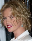 Charlize Theron's curly mid-length bob with layers for volume