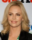 Charlize Theron wearing her hair curled away from her face