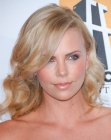 Charlize Theron with her medium length hair cut in long layers