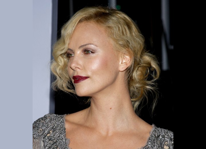 Charlize Theron's hair styled up for a 1930s look
