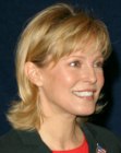 Cheryl Ladd's layered haircut with a long neck section