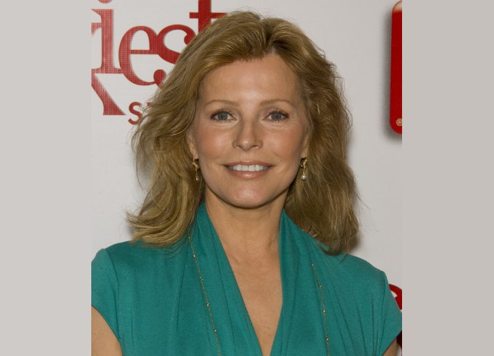 Cheryl Ladd with her long hair styled back out of the face for a feminine