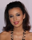 Christian Serratos with her hair cut in a style that flips above the shoulders