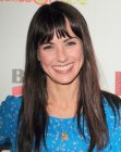 Constance Zimmer with long dark brown hair