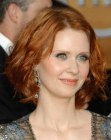 Cynthia Nixon with short red hair with layers