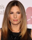 Daisy Fuentes with her long hair angled along the sides an straightened