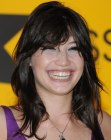 Brunette Daisy Lowe with her hair cut in a long shag