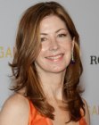 Dana Delany wearing her hair long with flowing curls