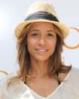 Dania Ramirez with casual long hair and wearing a straw hat