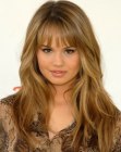 Debby Ryan's soft long hair with layers and thin bangs