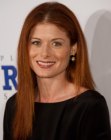 Debra Messing wearing her red hair long and straightened