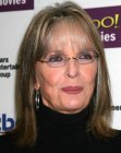 Diane Keaton with her hair cut at the shoulders and flipping out