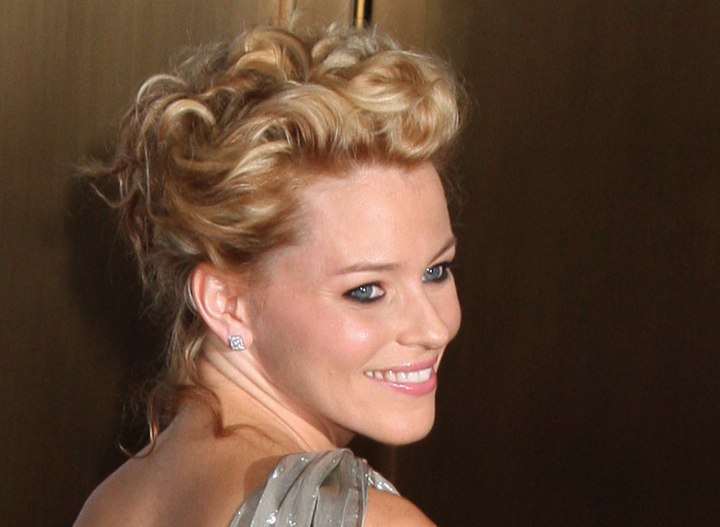 Elizabeth Banks with her hair brought up in curls