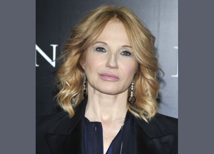 Ellen Barkin with her long hair scooped away on the sides