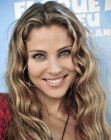 Elsa Pataky wearing her hair long and with natural curls