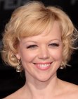 Emily Bergl's short 1960s hairstyle with curls