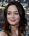 Emily Blunt's long hair with a center part and curls