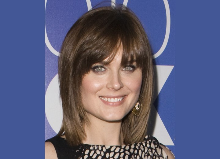 Emily Deschanel - Neck length hairstyle with angling down the sides