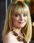 Emma Stone wearing her long straight hair with blunt cut eyebrow length bangs
