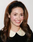 Emmy Rossum wearing her hair combed back away from her face and with a hair band